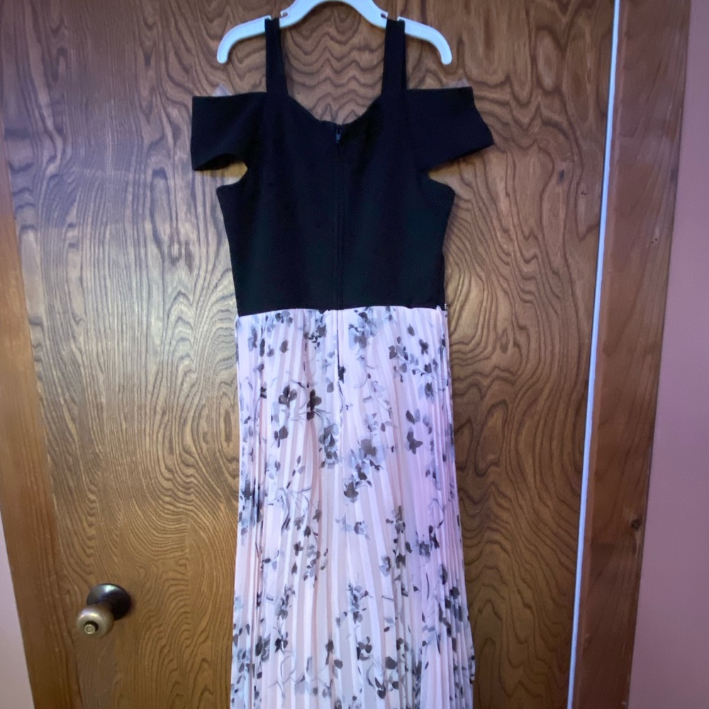 Dress with black top and pink floral bottom with off the shoulder sleeves.